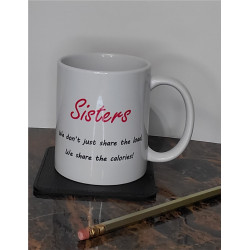 humorous coffee mug sister's we don't just share the load, we share the calories! on coaster with pencil